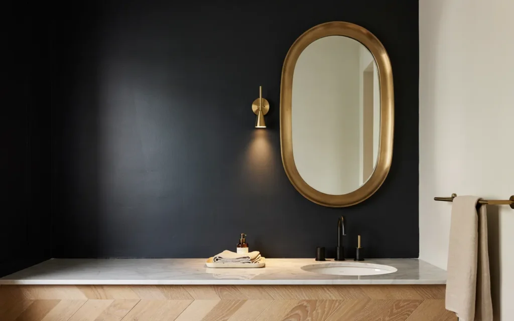 15. Black Accent Wall in a Small Powder Room
